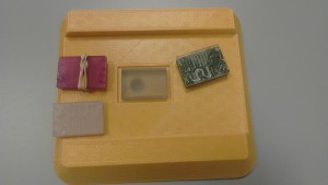 Stereolithography printed chip (grey) can be seen in comparison to the detector structure.